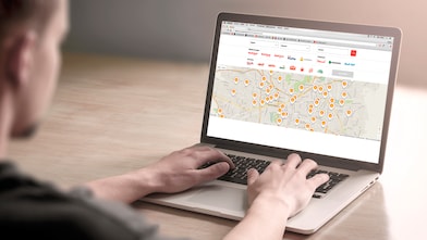 Man looking at a map on a computer