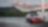 Red car in Shell forecourt