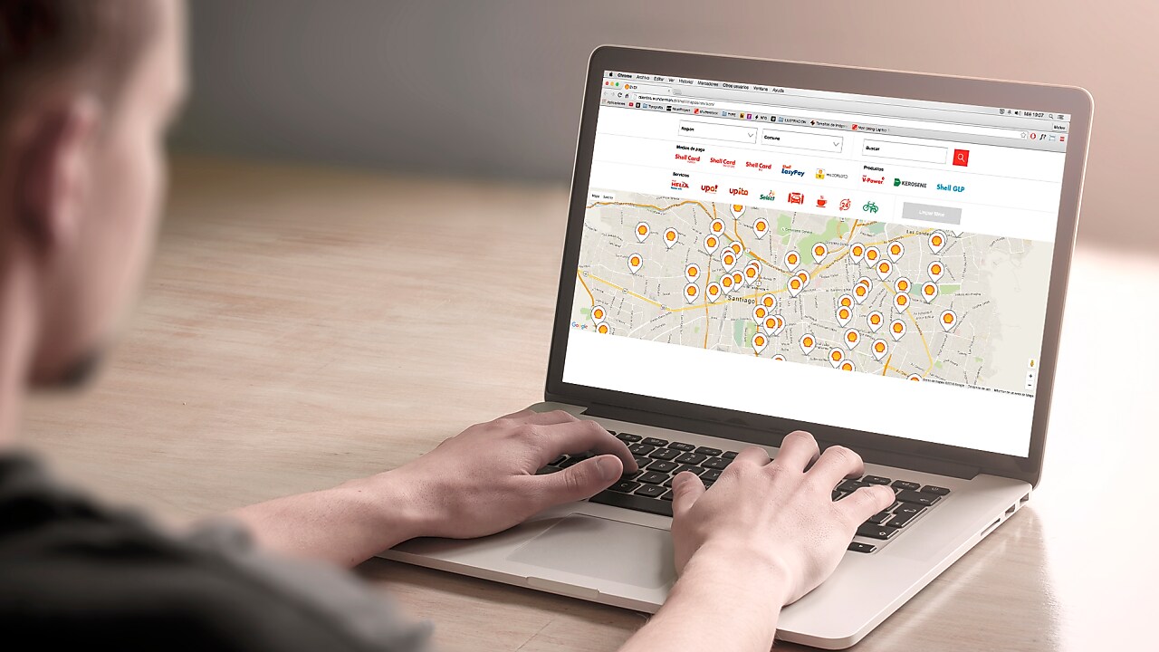 Man looking at a map on a computer