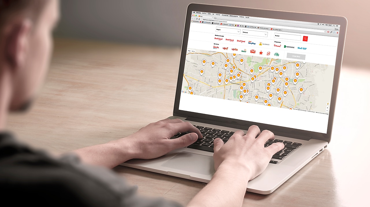 Man looking at a map on a computer