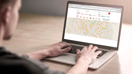 Man looking at a map on a computer