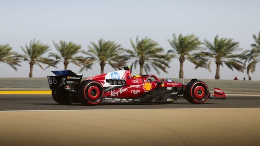 Ferrari F1 car racing on sunny track with palm trees