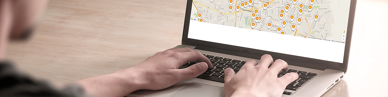 Man looking at a map on a computer